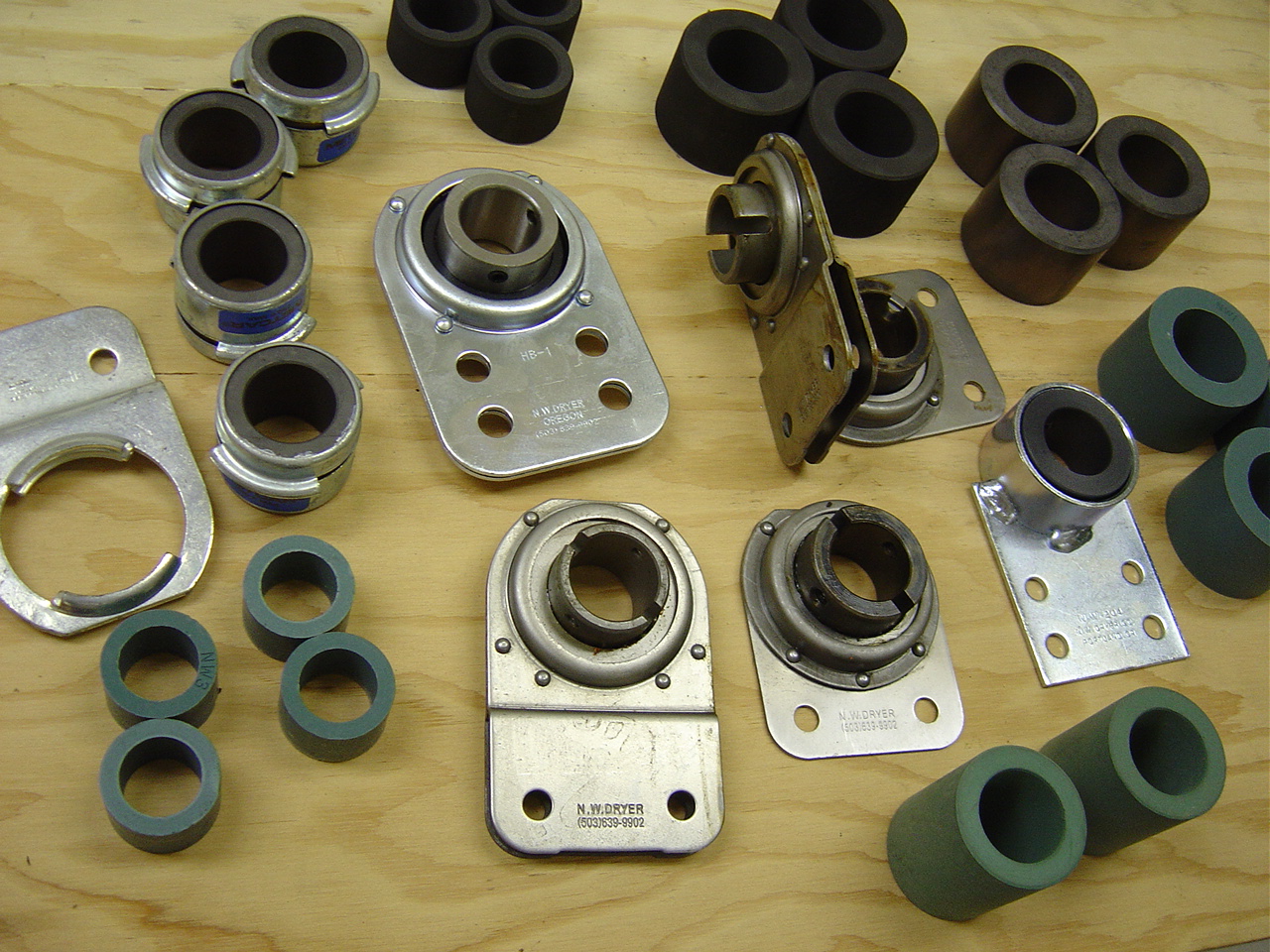 Assorted Northwest Dryer bearing brackets and bushings